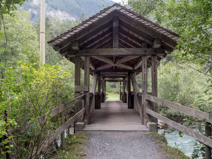 Covered wooden bridge over the Albula River in Alvaneu-Bad, Canton of Grisons, Switzerland