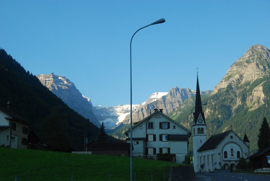 Catholic church of Linthal with Bifertenfirn glacier in the background, canton of Glarus, Switzerland
